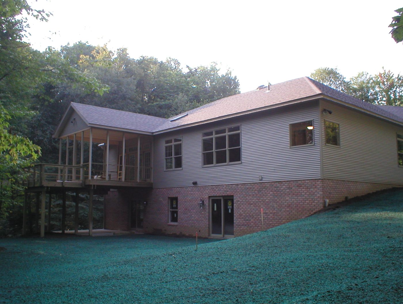 Walkout ranch home with screened porch on a wooded Ohio lot