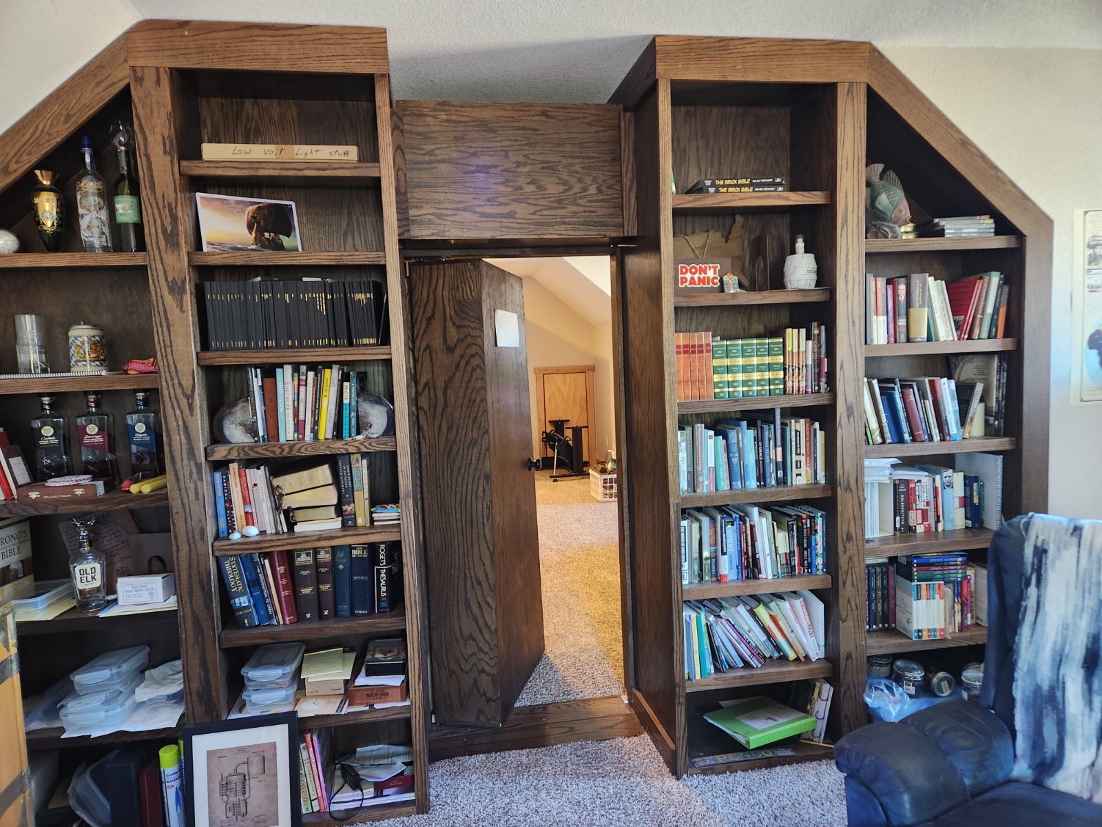 The bookcase door swung open from the speakeasy side